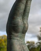 The Equilibrium Handstand Garden Sculpture in Verdigris Showing a Close up of the Head