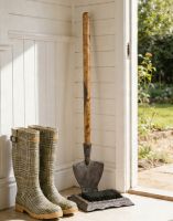 The Esther Garden Spade Boot Scraper & Brush Placed in a Cream Entrance Porch - Digital Illustration 