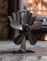 The Five Blade Heat Powered Stove Fan in Front of a Traditional Log Burner - Digital Illustration 
