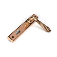 The Fluted Slimline Exterior Door Handle in a Polished Bronze Finish Shown at an Angle The Fluted Slimline Exterior Door Handle in a Polished Bronze Finish Shown at an Angle