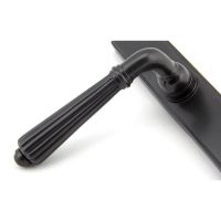 The Fluted Slimline Exterior Door Handle in an Aged Bronze Finish Showing a Close up of the Handle The Fluted Slimline Exterior Door Handle in an Aged Bronze Finish Showing a Close up of the Handle