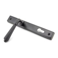 The Fluted Slimline Exterior Door Handle in an Aged Bronze Finish Shown Leaning to the Left The Fluted Slimline Exterior Door Handle in an Aged Bronze Finish Shown Leaning to the Left