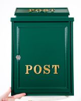 The Forest Green "Oxford" Wall Mounted Post Box with Gold Detail with Hand in Shot for Scale