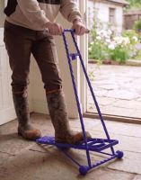 The Glenmore Lilac Boot Jack Shown Being used in a Sunny Cottage Porch Entranceway - Digital Illustration 