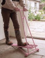 The Glenmore Pink Boot Jack Being Used in a Stone Tiled Garden Porch - Digital Illustration The Glenmore Pink Boot Jack Being Used in a Stone Tiled Garden Porch - Digital Illustration