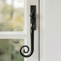 The Glossy Black Monkeytail Espagnolette Window Handle Fittted on a Classic White Painted Window Frame - Digital Illustration 