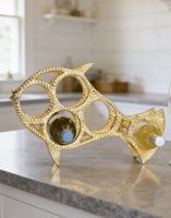 The Gold "Fish" Wine Rack Displayed on a Kitchen Work top in a Modern Home - Digital Illustration The Gold "Fish" Wine Rack Displayed on a Kitchen Work top in a Modern Home - Digital Illustration