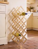 The Gold "Geometric Grid" Wine Rack Stood in a Traditional Country Home Kitchen on a Brick Floor - Digital Illustration The Gold "Geometric Grid" Wine Rack Stood in a Traditional Country Home Kitchen on a Brick Floor - Digital Illustration