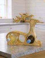 The Gold "Laying Stag" Wine Rack on a Modern Kitchen Countertop in a White Interior - Digital Illustration