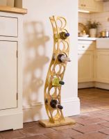 The Gold "Serena" Curved Wine Rack Placed on a Polished Brick Floor in a Contemporary Country Kitchen - Digital Illustration