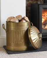 The Gold Traditional Iron Log Bucket With Lid Filled with Logs next to a Lit Log Burner Stove - Digital Illustration The Gold Traditional Iron Log Bucket With Lid Filled with Logs next to a Lit Log Burner Stove - Digital Illustration