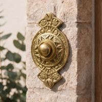 The “Hampern Close” Polished Brass Decorative Bell Push on a Stone Wall on the Front of a Country Home - Digital Illustration The “Hampern Close” Polished Brass Decorative Bell Push on a Stone Wall on the Front of a Country Home - Digital Illustration