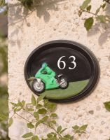 The Hand Painted Sport Touring Motorbike House Sign Attached to a Wall in a Front Garden - Digital Illustration The Hand Painted Sport Touring Motorbike House Sign Attached to a Wall in a Front Garden - Digital Illustration