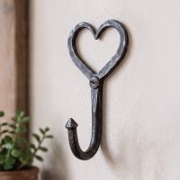 The Heart-Shaped Coat Hook Mounted on a Cream Wall in a Traditional Home Interior - Digital Illustration The Heart-Shaped Coat Hook Mounted on a Cream Wall in a Traditional Home Interior - Digital Illustration