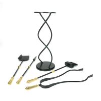 The Helix Fireside Companion Set with Golden Reeded Handles in Matt Black Shown laid out on a White Background