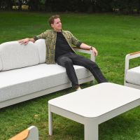 The Horizon 4 Piece Patio Suite Showing a Close up of a Man Sat on the Garden Sofa