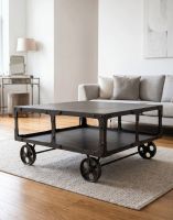 The Industrial Steel Coffee Table in the Centre of a Well lit Living Room Interior - Digital Illustration The Industrial Steel Coffee Table in the Centre of a Well lit Living Room Interior - Digital Illustration