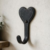 The Iron Heart Hook Shown Close up on a Magnolia Coloured Wall - Digital Illustration