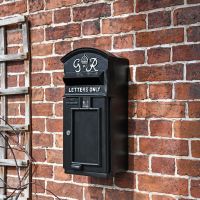 The King George Post Box Slim In Situ on a Black Wall