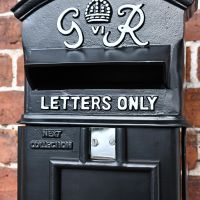 Close-up of the Letter Aperture on the The King George Post Box Slim In Black