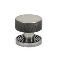 The Knurled Mortice/Rim Knob Set on a Beehive Rose in Pewter Shown Upright on a White Background The Knurled Mortice/Rim Knob Set on a Beehive Rose in Pewter Shown Upright on a White Background