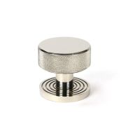The Knurled Mortice/Rim Knob Set on a Beehive Rose in Polished Nickel Shown Upright on a White Background The Knurled Mortice/Rim Knob Set on a Beehive Rose in Polished Nickel Shown Upright on a White Background