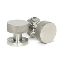 The Knurled Mortice/Rim Knob Set on a Beehive Rose in Satin Stainless Steel Shown Upright and on its Side The Knurled Mortice/Rim Knob Set on a Beehive Rose in Satin Stainless Steel Shown Upright and on its Side
