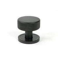 The Knurled Mortice/Rim Knob Set on a Plain Rose in Aged Bronze Shown Upright on a White Background The Knurled Mortice/Rim Knob Set on a Plain Rose in Aged Bronze Shown Upright on a White Background