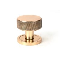 The Knurled Mortice/Rim Knob Set on a Plain Rose in Polished Bronze Shown Upright on a White Background The Knurled Mortice/Rim Knob Set on a Plain Rose in Polished Bronze Shown Upright on a White Background