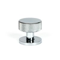 The Knurled Mortice/Rim Knob Set on a Plain Rose in Polished Chrome Shown Upright on a White Background The Knurled Mortice/Rim Knob Set on a Plain Rose in Polished Chrome Shown Upright on a White Background