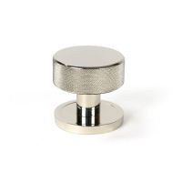 The Knurled Mortice/Rim Knob Set on a Plain Rose in Polished Nickel Shown Upright on a White Background The Knurled Mortice/Rim Knob Set on a Plain Rose in Polished Nickel Shown Upright on a White Background