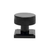 The Knurled Mortice/Rim Knob Set on a Square Rose in Black Shown Upright on a White Background The Knurled Mortice/Rim Knob Set on a Square Rose in Black Shown Upright on a White Background