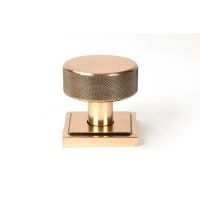 The Knurled Mortice/Rim Knob Set on a Square Rose in Polished Bronze Shown Upright on a White Background The Knurled Mortice/Rim Knob Set on a Square Rose in Polished Bronze Shown Upright on a White Background