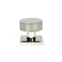 The Knurled Mortice/Rim Knob Set on a Square Rose in Polished Stainless Steel Shown Upright on a White Background The Knurled Mortice/Rim Knob Set on a Square Rose in Polished Stainless Steel Shown Upright on a White Background