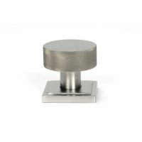 The Knurled Mortice/Rim Knob Set on a Square Rose in Satin Stainless Steel Shown Upright on a White Background The Knurled Mortice/Rim Knob Set on a Square Rose in Satin Stainless Steel Shown Upright on a White Background