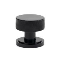 The Knurled Mortice/Rim Knob Set on an Art Deco Rose in Black Shown Upright on a White Background The Knurled Mortice/Rim Knob Set on an Art Deco Rose in Black Shown Upright on a White Background