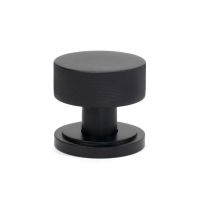 The Knurled Mortice/Rim Knob Set on an Art Deco Rose in Matt Black Shown Upright on a White Background The Knurled Mortice/Rim Knob Set on an Art Deco Rose in Matt Black Shown Upright on a White Background