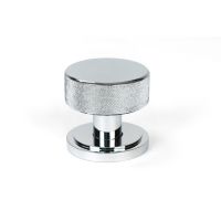 The Knurled Mortice/Rim Knob Set on an Art Deco Rose in Polished Chrome Shown Upright on a White Background The Knurled Mortice/Rim Knob Set on an Art Deco Rose in Polished Chrome Shown Upright on a White Background