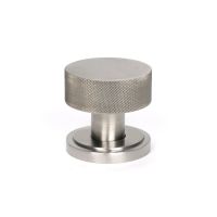 The Knurled Mortice/Rim Knob Set on an Art Deco Rose in Satin Stainless Steel Shown Upright on a White Background The Knurled Mortice/Rim Knob Set on an Art Deco Rose in Satin Stainless Steel Shown Upright on a White Background