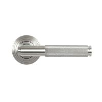 The Knurled Sprung Handle Set on a Beehive Rose in Satin Stainless Steel Shown from the Front on a White Background