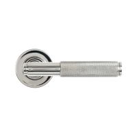 The Knurled Sprung Handle Set on a Round Rose in Polished Stainless Steel Shown from the Front on a White Background