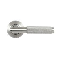 The Knurled Sprung Handle Set on a Round Rose in Satin Stainless Steel Shown from the Front on a White Background