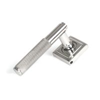 The Knurled Sprung Handle Set on a Square Rose in Polished Stainless Steel Shown at an Angle on a White Background