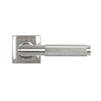 The Knurled Sprung Handle Set on a Square Rose in Satin Stainless Steel Shown from the Front on a White Background