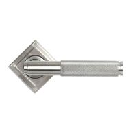 The Knurled Sprung Handle Set on a Square Rose in Satin Stainless Steel Shown with the Square Backplate in a Diamond Orientation