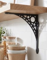 The Large 33 x 33cm "Ironbridge" Shelf Bracket Mounted on a White Tiled Modern Kitchen on a Wooden Shelf - Digital Illustration The Large 33 x 33cm "Ironbridge" Shelf Bracket Mounted on a White Tiled Modern Kitchen on a Wooden Shelf - Digital Illustration