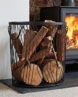 The Large Art Deco Wire Log Basket on a Black Hearth next to a Stove - Digital Illustration 