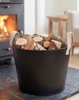 The Large Black Contemporary Dotted Log Basket on a Black Stone Hearth by a Log Burner Stove - Digital Illustration The Large Black Contemporary Dotted Log Basket on a Black Stone Hearth by a Log Burner Stove - Digital Illustration