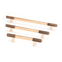 The Large Half Knurled Cabinet Pull Handle in Polished Bronze Shown Alongside Other Sizes on a White Background The Large Half Knurled Cabinet Pull Handle in Polished Bronze Shown Alongside Other Sizes on a White Background