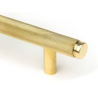 The Large Knurled Cabinet Pull Handle in Polished Brass Showing a Close up of the Edge of the Handle